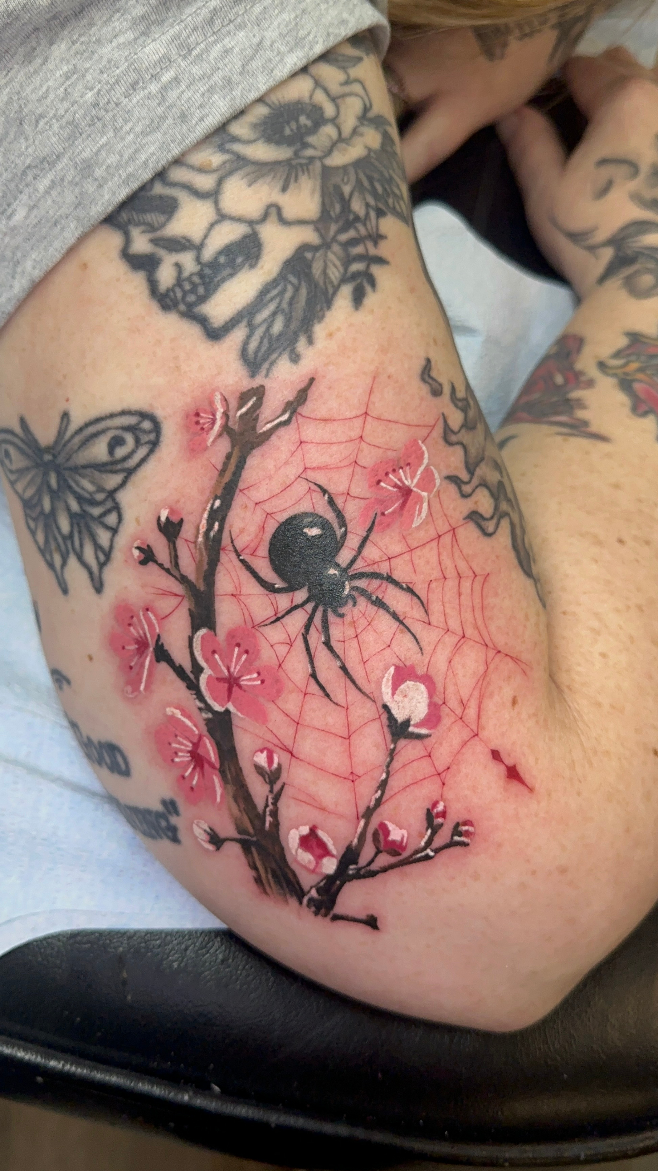 fine line spider tattoo.png