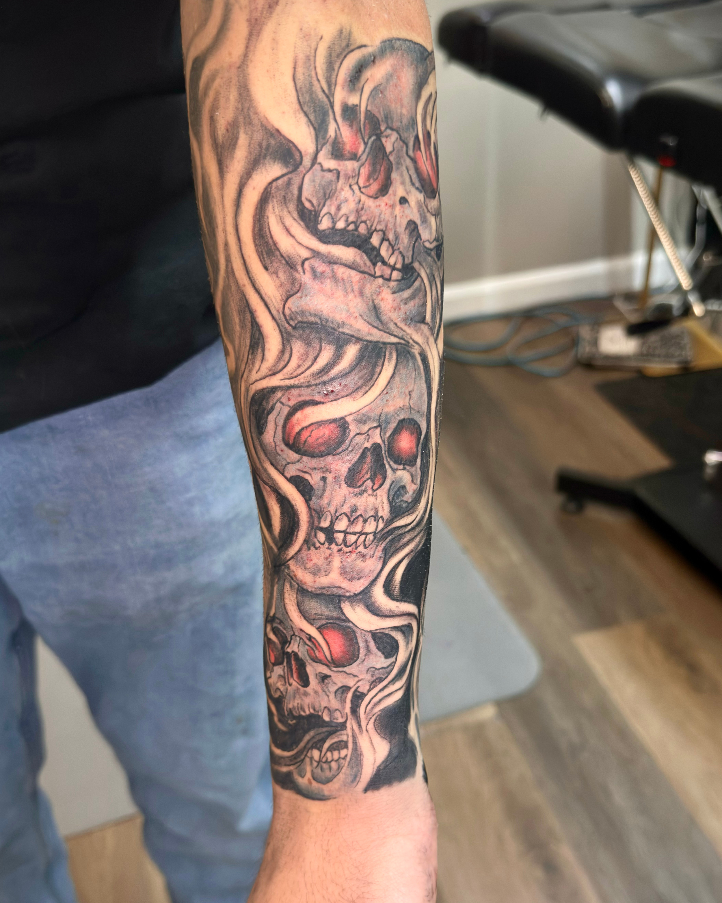 Black and Grey skull forearm tattoo