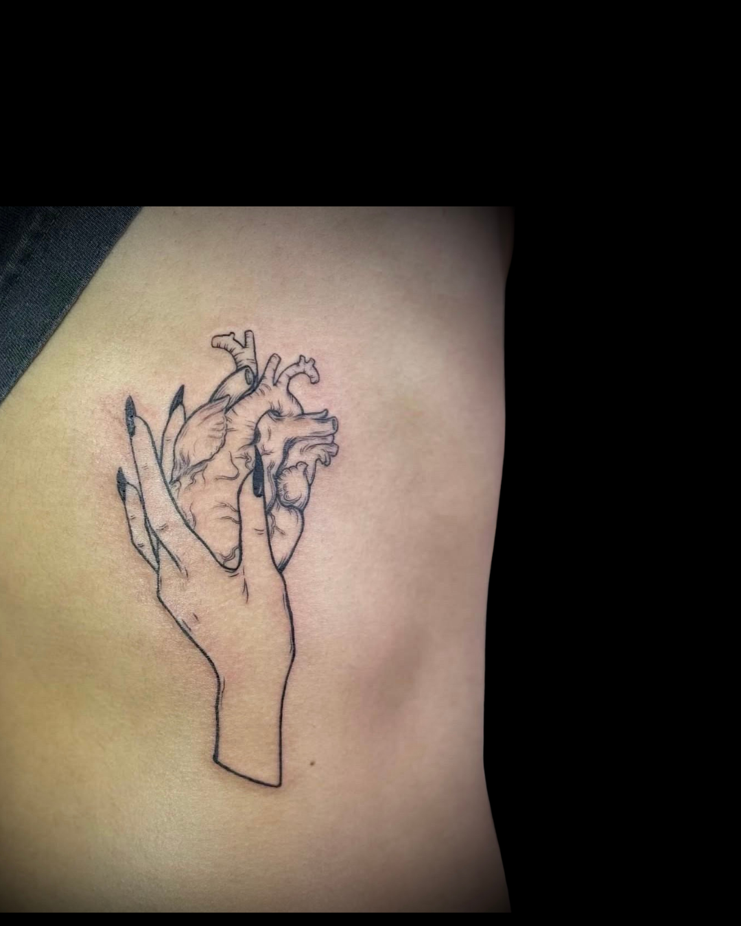 hand and heart tattoo