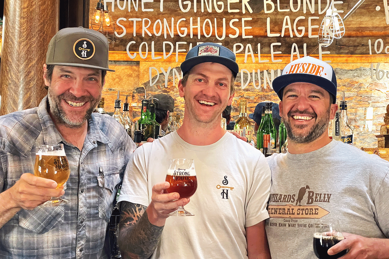 stronghouse telluride guys with beer in front of bar