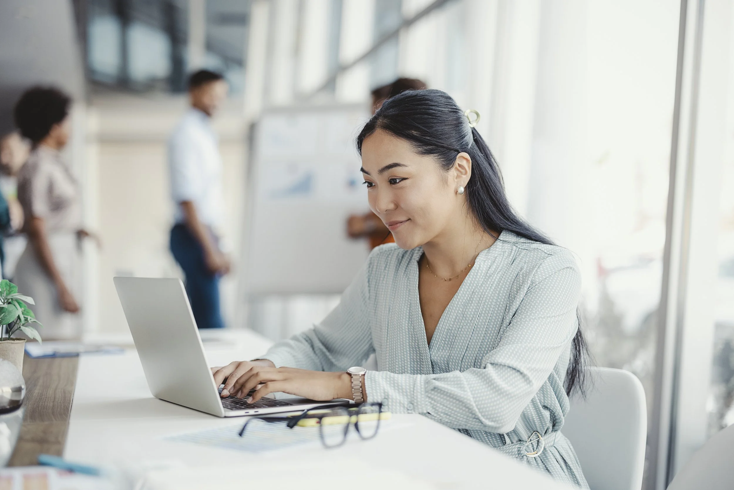 Female typing on computer