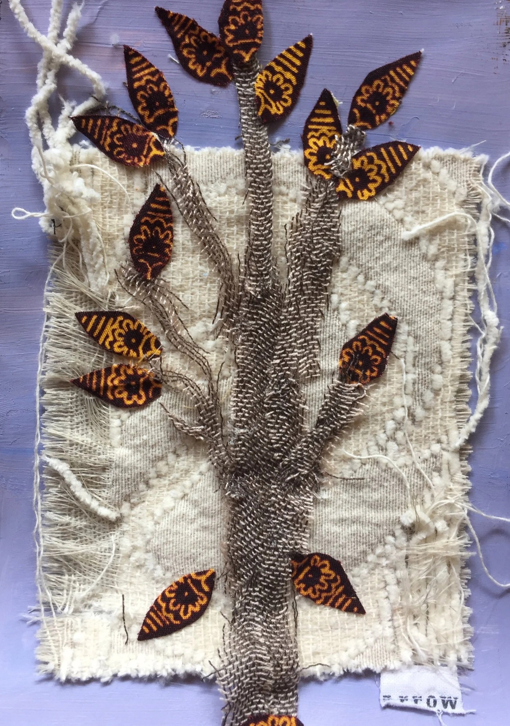 "Life Transitions as Tree" explores major life decisions and significant seasons of change through symbolism and metaphor. This mixed-media piece incorporates textiles, acrylic paint, and adhesives to reflect the layered nature of growth, transition,