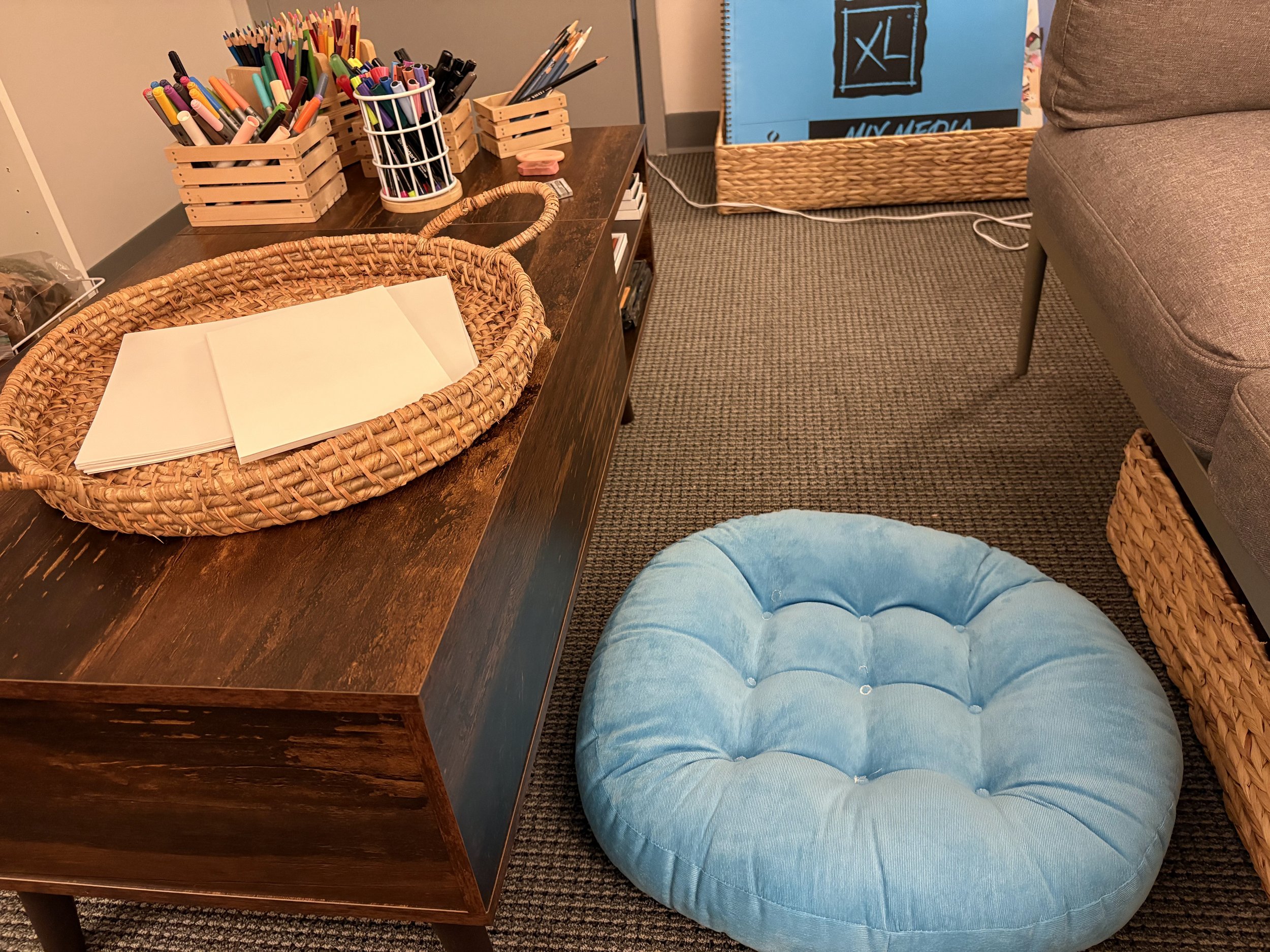 Plush seating pads are available for all ages and for those who enjoy working from the floor or need additional space. A variety of seating options are available throughout the space.