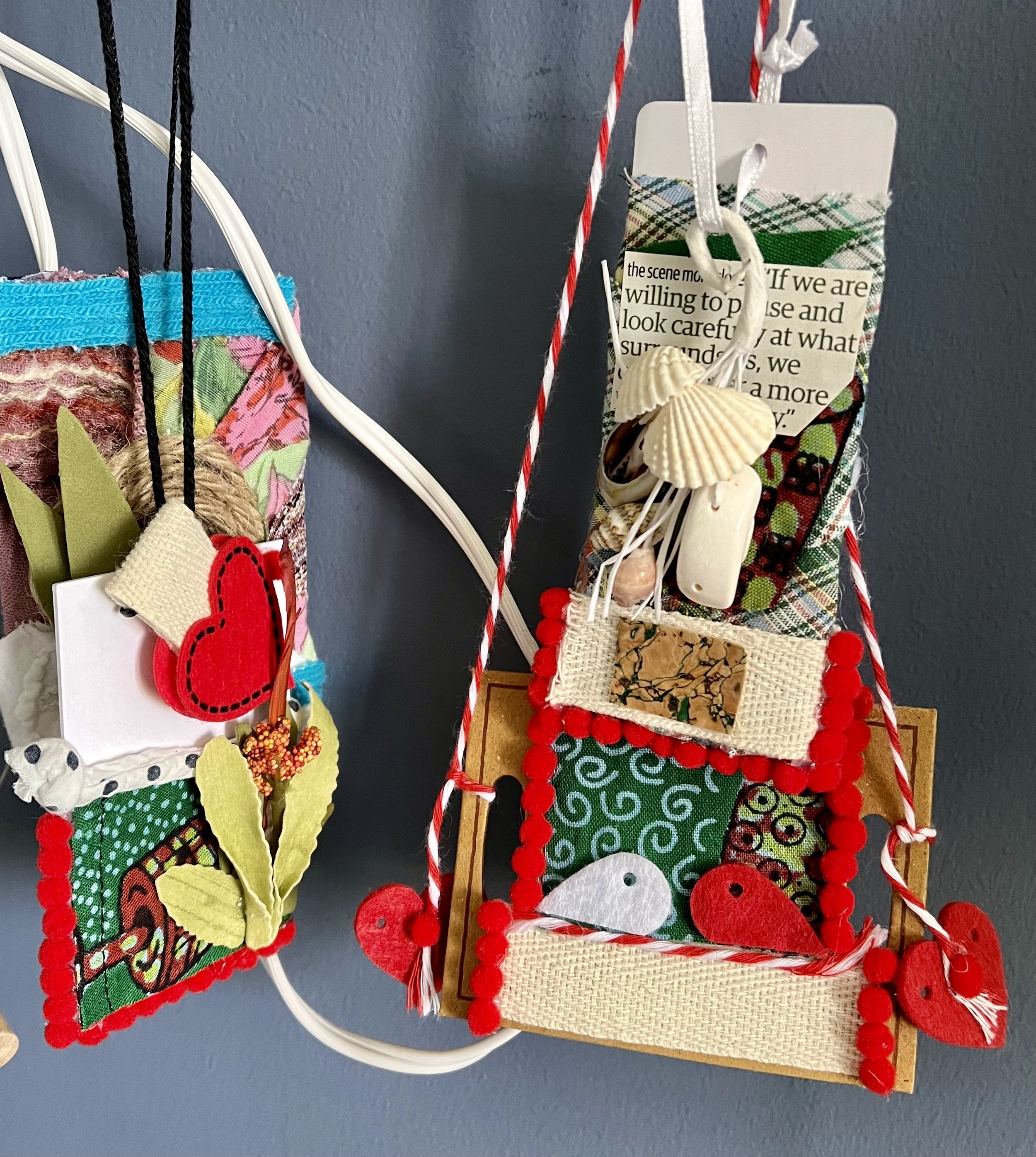 "Quote Tags" (multiple pieces), mixed media incorporating textiles, shells, found objects, thread, and paper. This wearable art study explores the idea of carrying memory through meaningful objects, symbolism, and personal reflection.