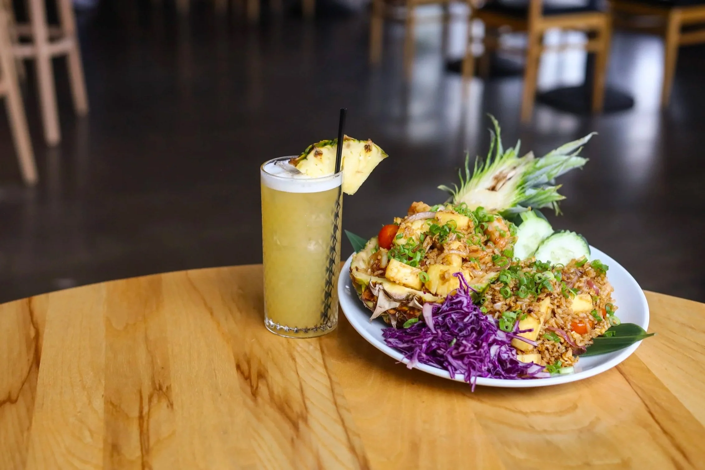 Pineapple fried rice and a tropical cocktail.