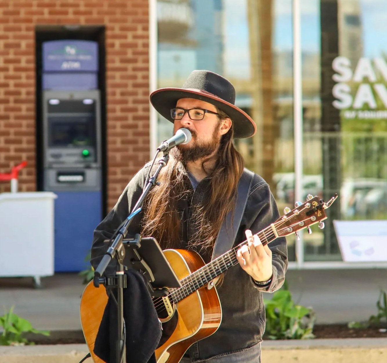 guitar player in a sunny outdoor setting