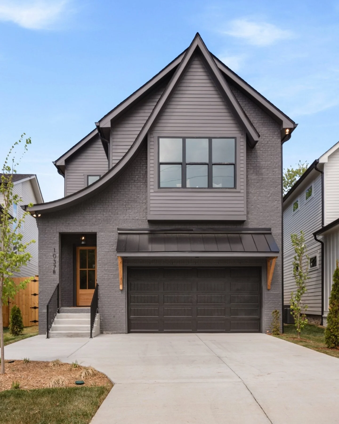 Bold on the outside, warm and intentional within. This new construction home pairs a striking black exterior with vaulted ceilings, wide-plank white oak floors, and light-filled living spaces that flow with ease. ✨

The kitchen is designed for real l