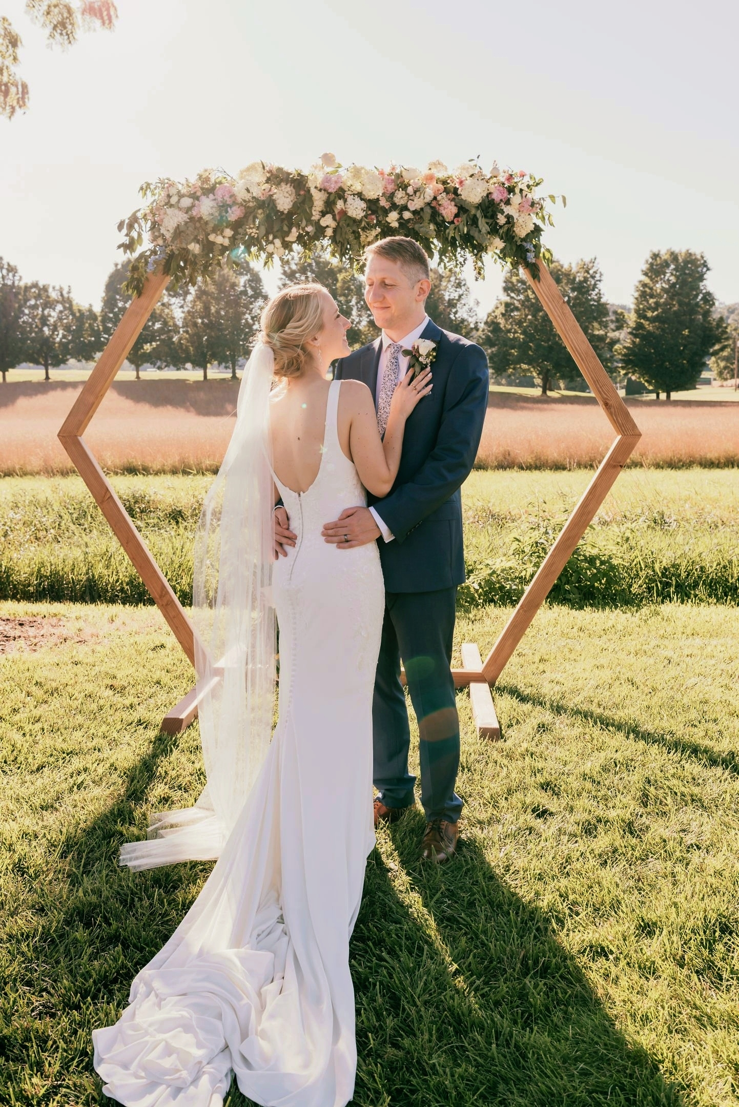 bride+and+groom+holding+each+other+wedding+pose.png