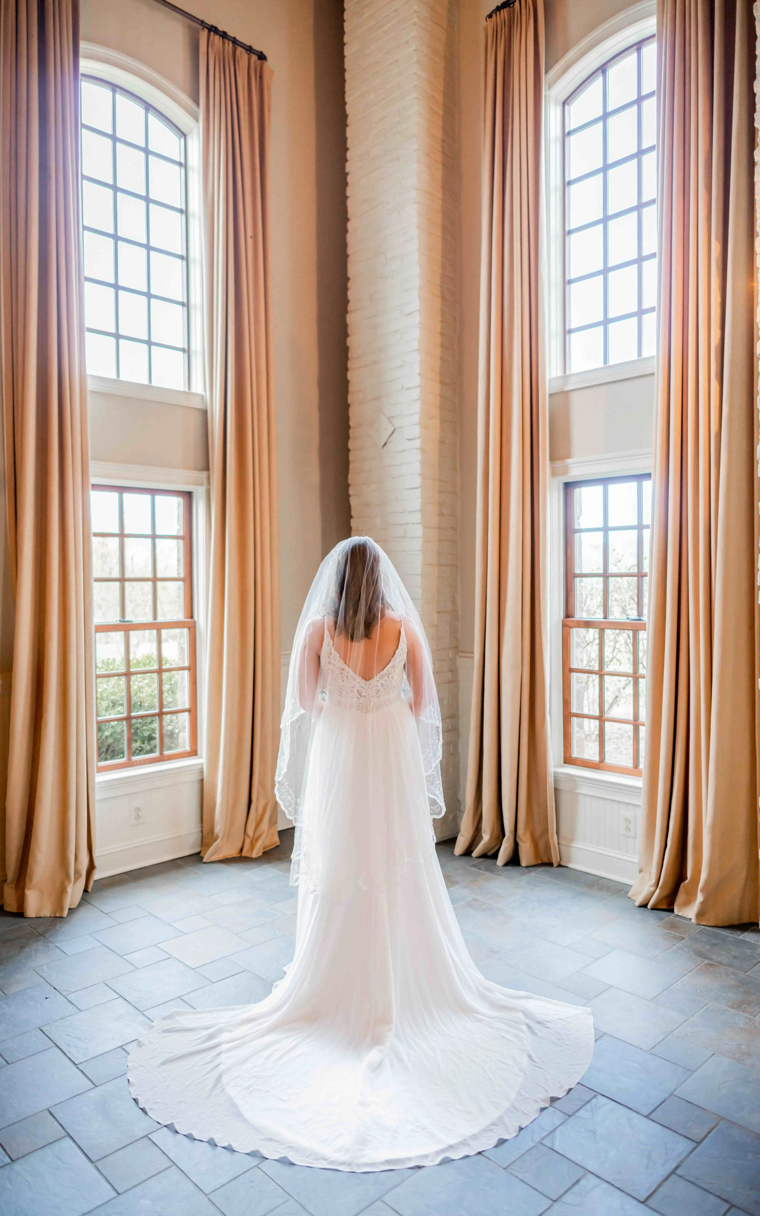 Bride+standing+in+window.jpg