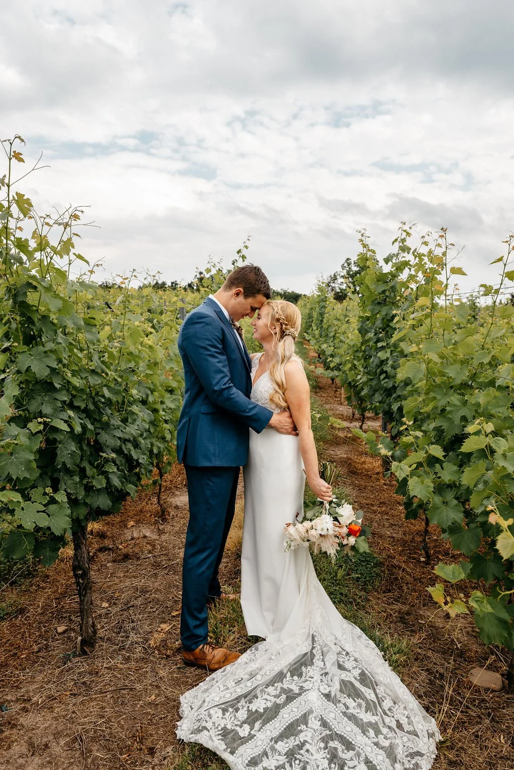 natural wedding photography in richmond virginia of couple in vineyard 