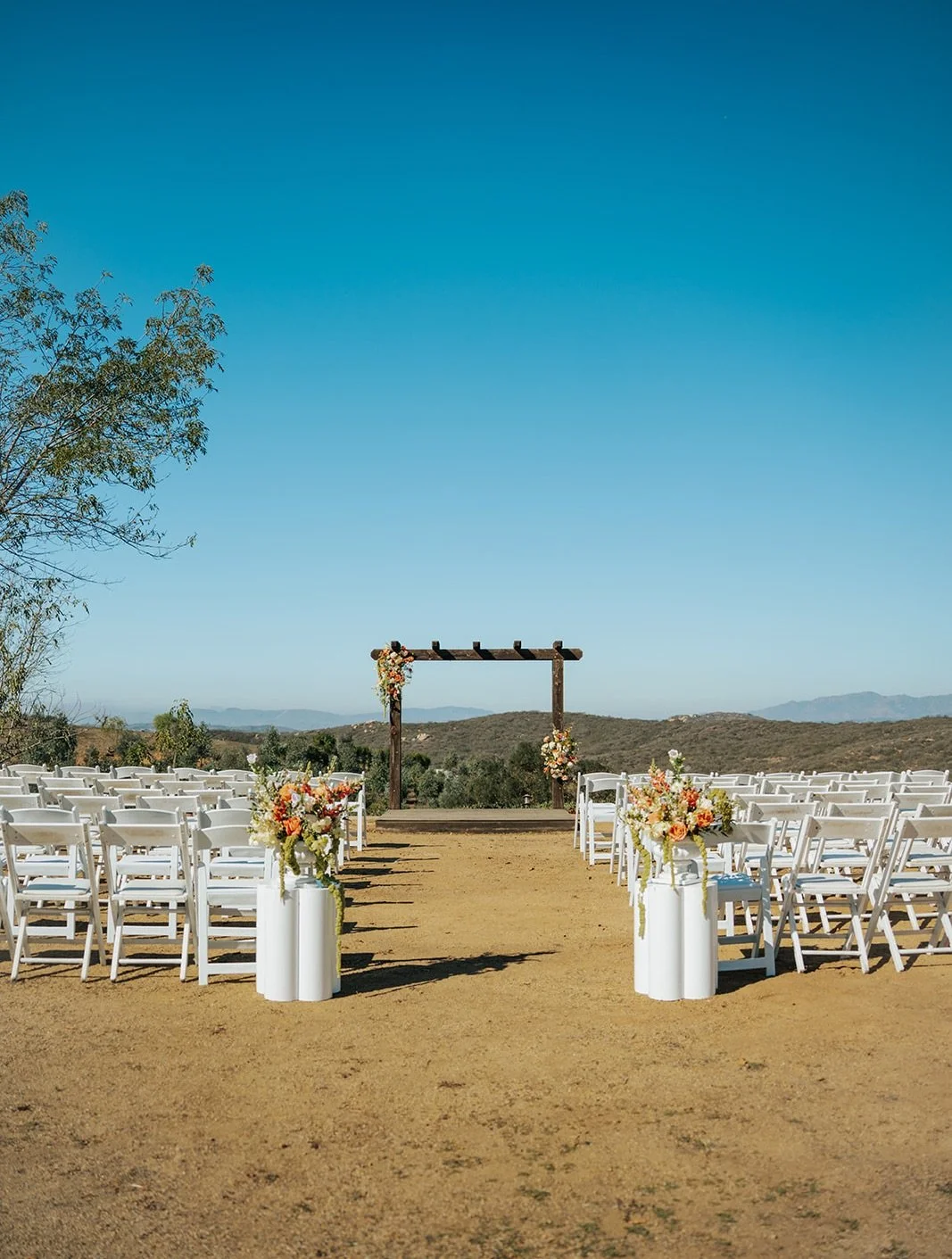 Meet these signature ceremony arch clusters , my most affordable way to frame your &ldquo;I do.&rdquo;

Cutesy, timeless, and finished with just enough color to give your ceremony that perfect pop. They make a statement without taking over and photog