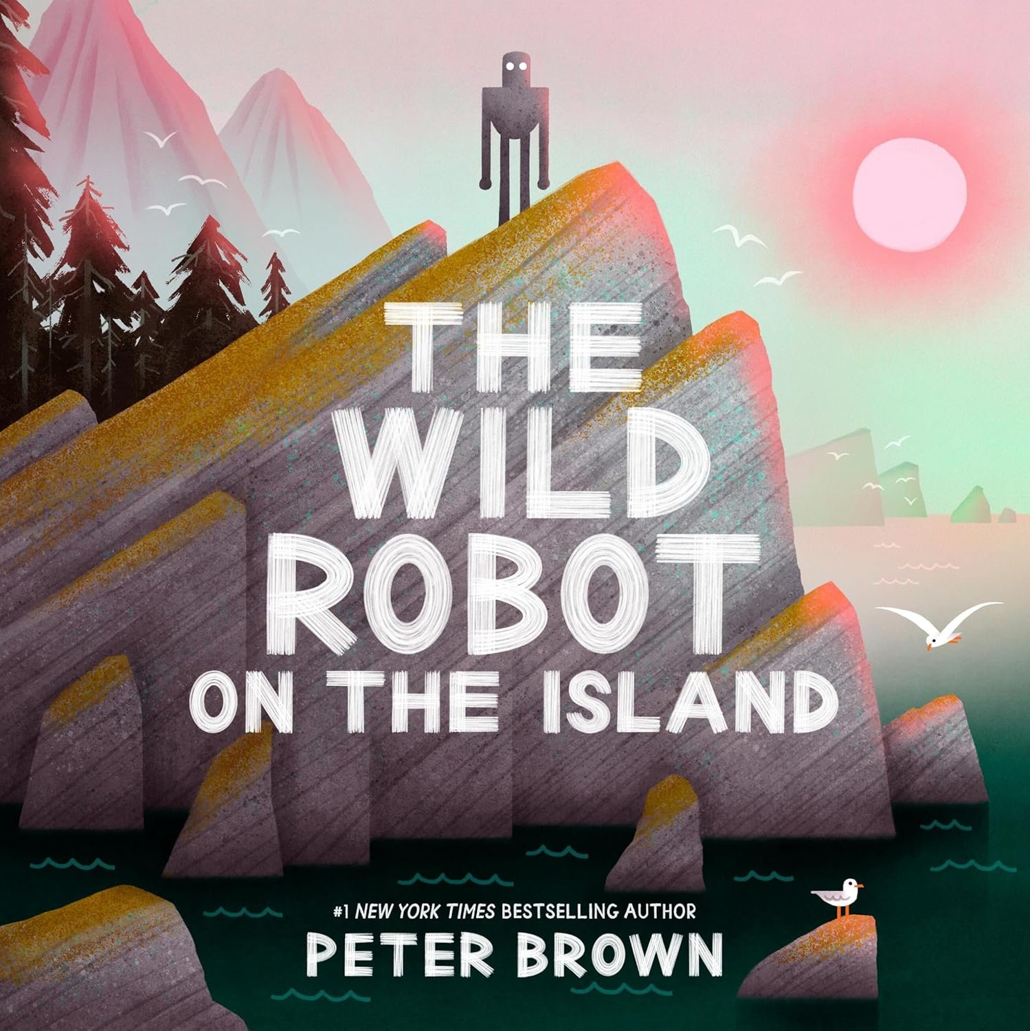 Book cover titled 'The Wild Robot on the Island' by Peter Brown, featuring a large rock formation with a robot standing on top, surrounded by trees, mountains, seagulls, and a pink sun in the sky.