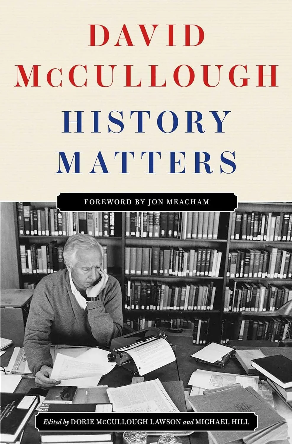 Book cover titled 'History Matters' by David McCullough, with a foreword by Jon Meacham. The cover features a black-and-white photo of a woman reading at a desk in front of bookshelves, surrounded by papers and notebooks.