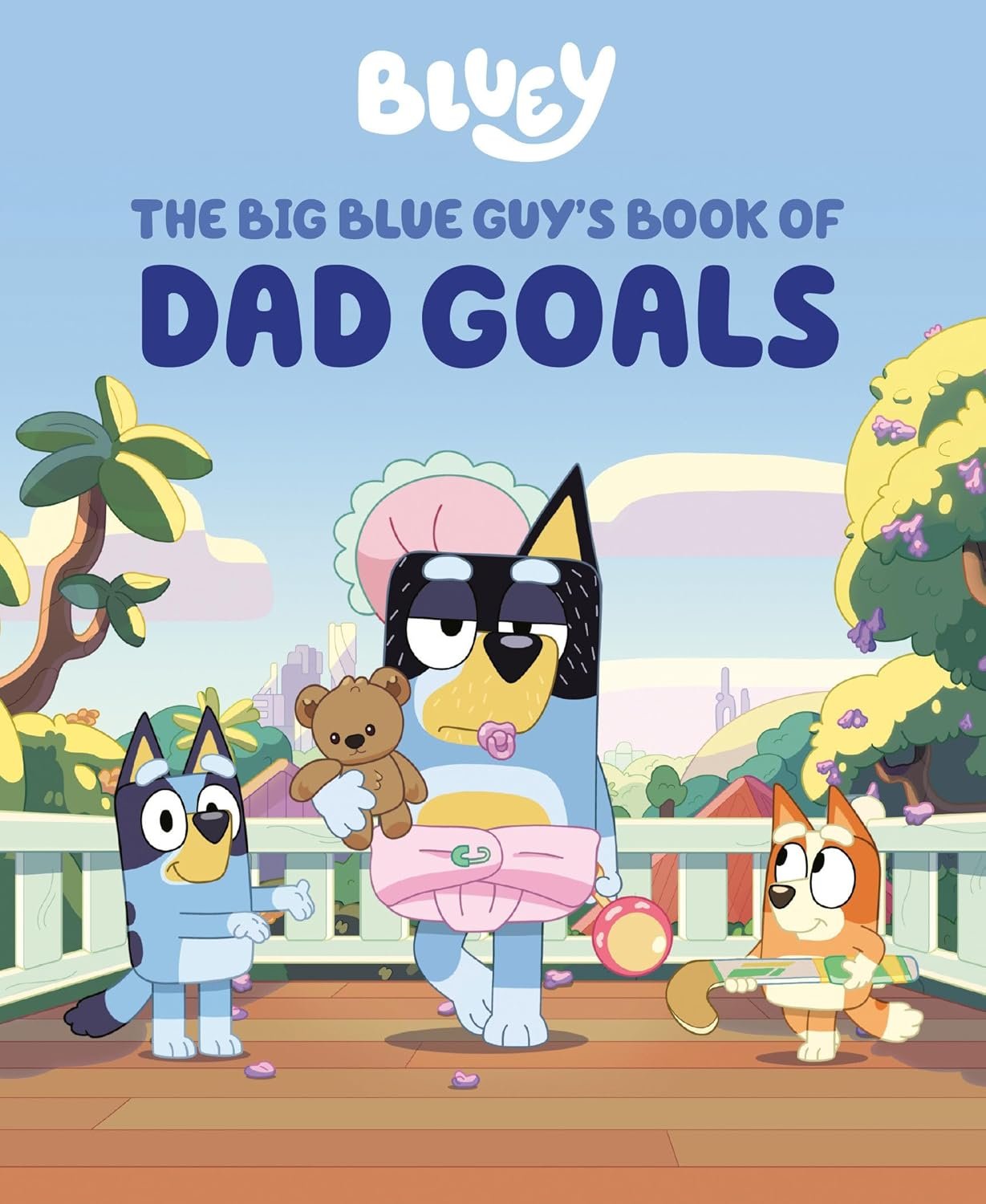 Cover of a Bluey book titled "The Big Blue Guy's Book of Dad Goals," featuring cartoon dogs on a deck with trees and flowers.