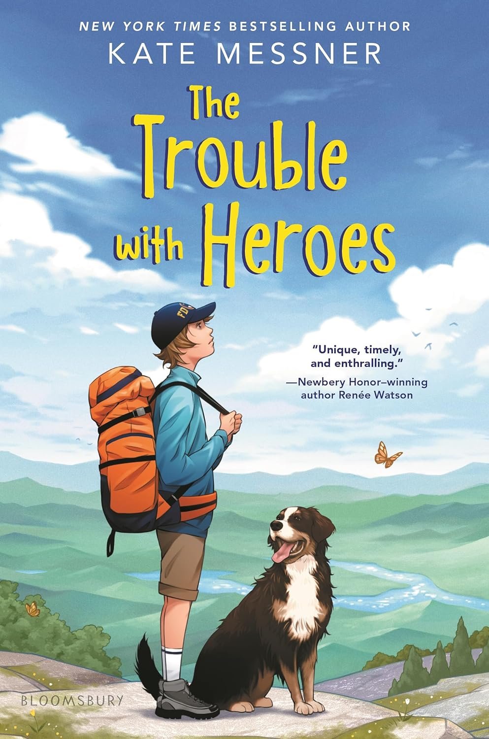 Cover of "The Trouble with Heroes" by Kate Messner featuring a boy with an orange backpack and cap standing with a dog on a grassy hill with mountains and a river in the background.