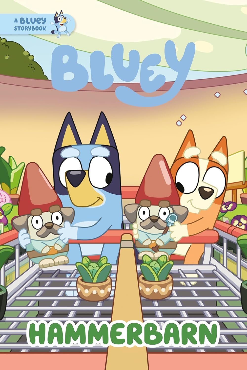 Cover of the children's book titled 'Bluey' depicting Bluey, a blue heeler dog, and her sister Bingo, a red heeler dog, shopping for vegetables with two small garden gnomes wearing red hats and glasses. The background shows a garden with flowers. The