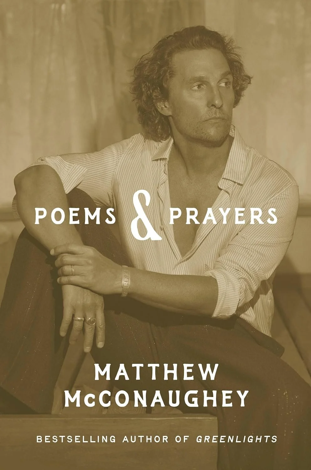 Book cover titled "Poems & Prayers" by Matthew McConaughey, featuring a sepia-toned photo of the author sitting with an acoustic guitar, wearing a striped shirt, with a contemplative expression.