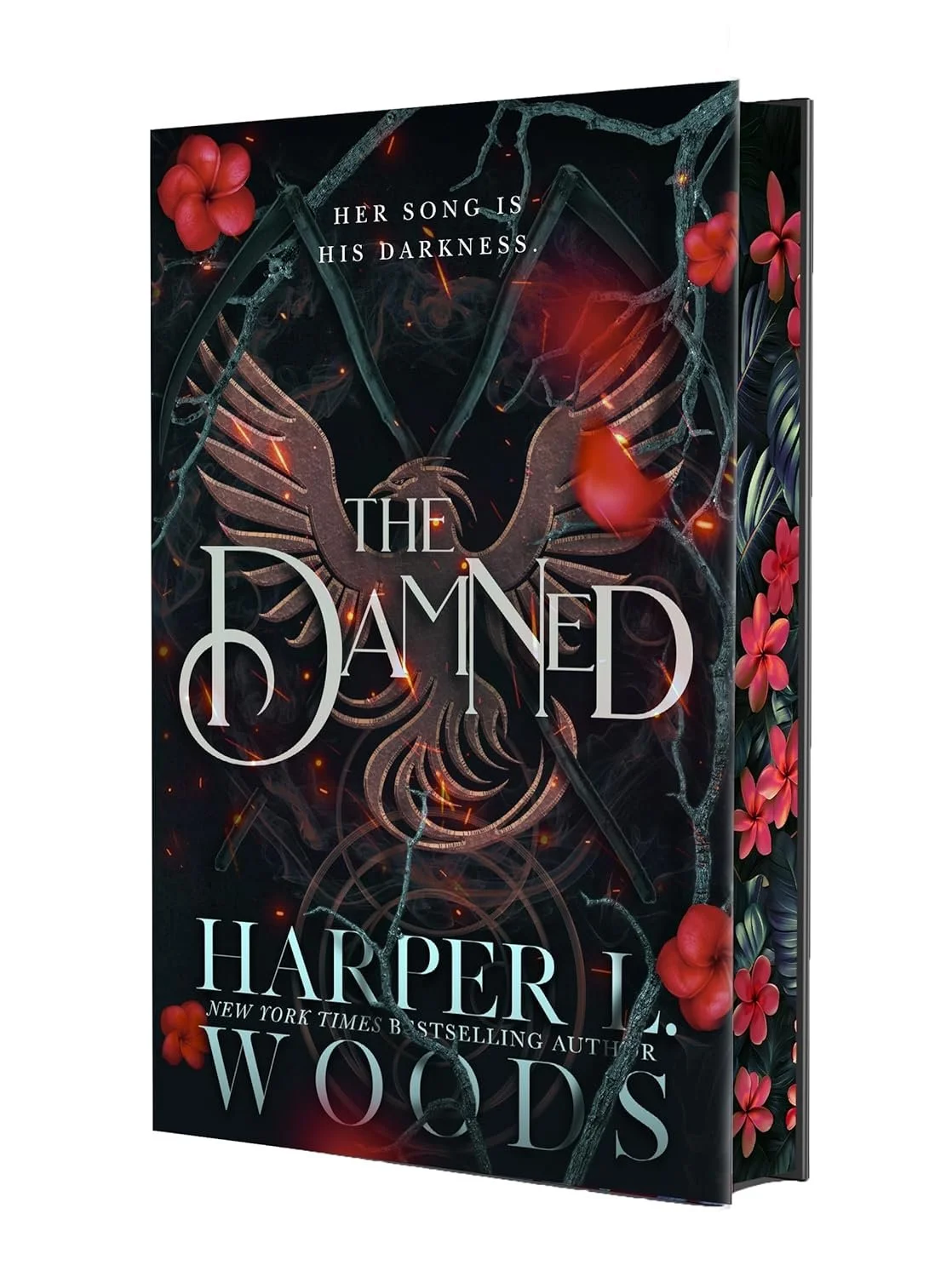 Cover of a book titled 'The Damned' by Harper L. Woods, featuring a dark background with a phoenix, branches, and pink flowers, with the subtitle 'Her song is his darkness.'
