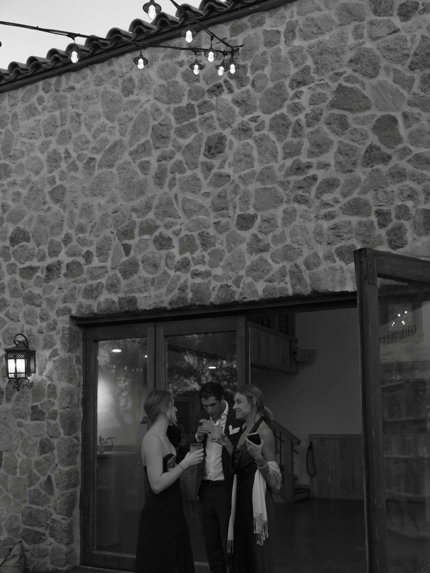 I adore cocktail hour candids!

I say editorial meets documentary for a reason. 
Some of the best shots from your wedding will be unplanned, and unposed. It&rsquo;s my job to find them scattered throughout your day.

Second shot for Erica Streelman!