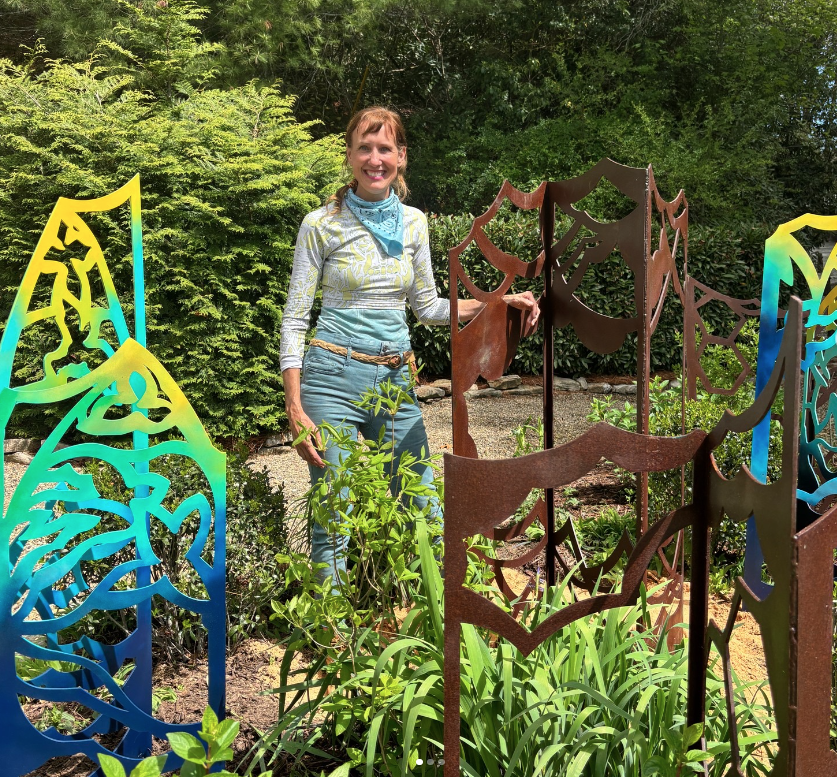 artist Jennifer York with sculpture at Cashiers Chamber of Commerce sky chapel