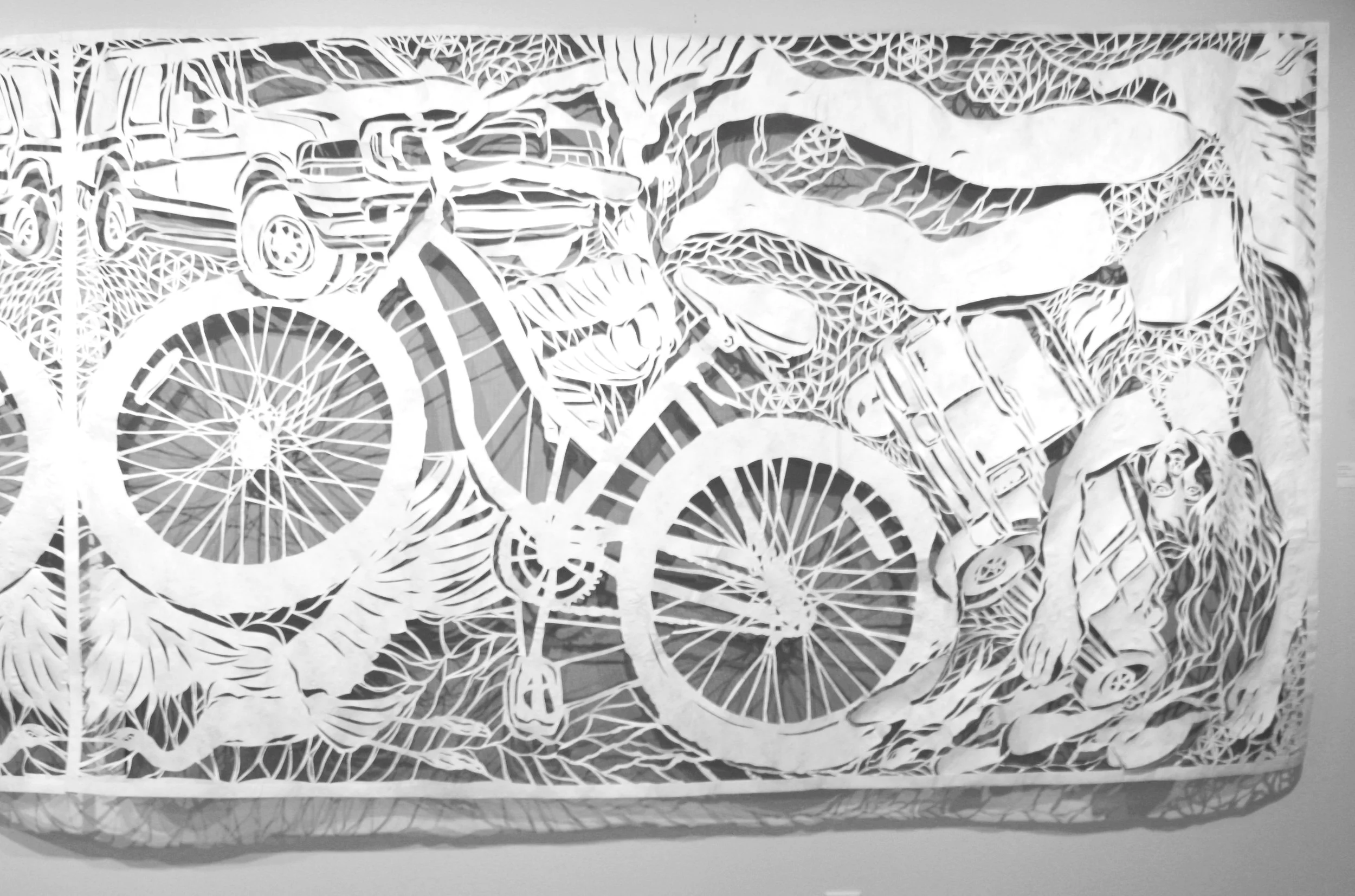 Detail, "Ghost Bike Elegy," tyvek papercut over porch screen, 5 ft h x 16 ft w, 2023