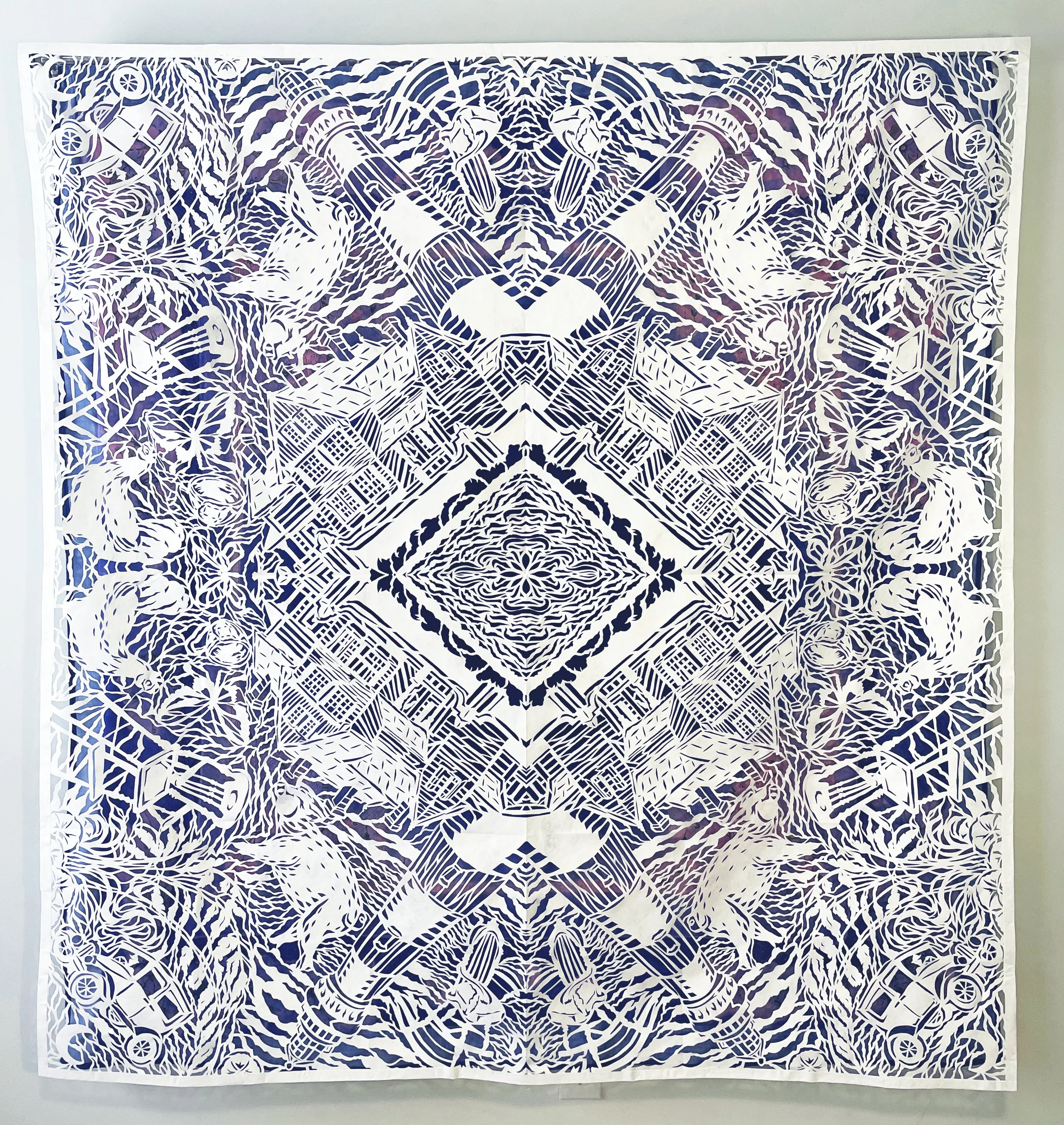 "Lightkeepers' Blues," tyvek papercut over indigo-dyed tablecloths. 72"h x 69"w, 2026. On view in "In the Making: Contemorary Craft from South Carolina" at the SC State Museum