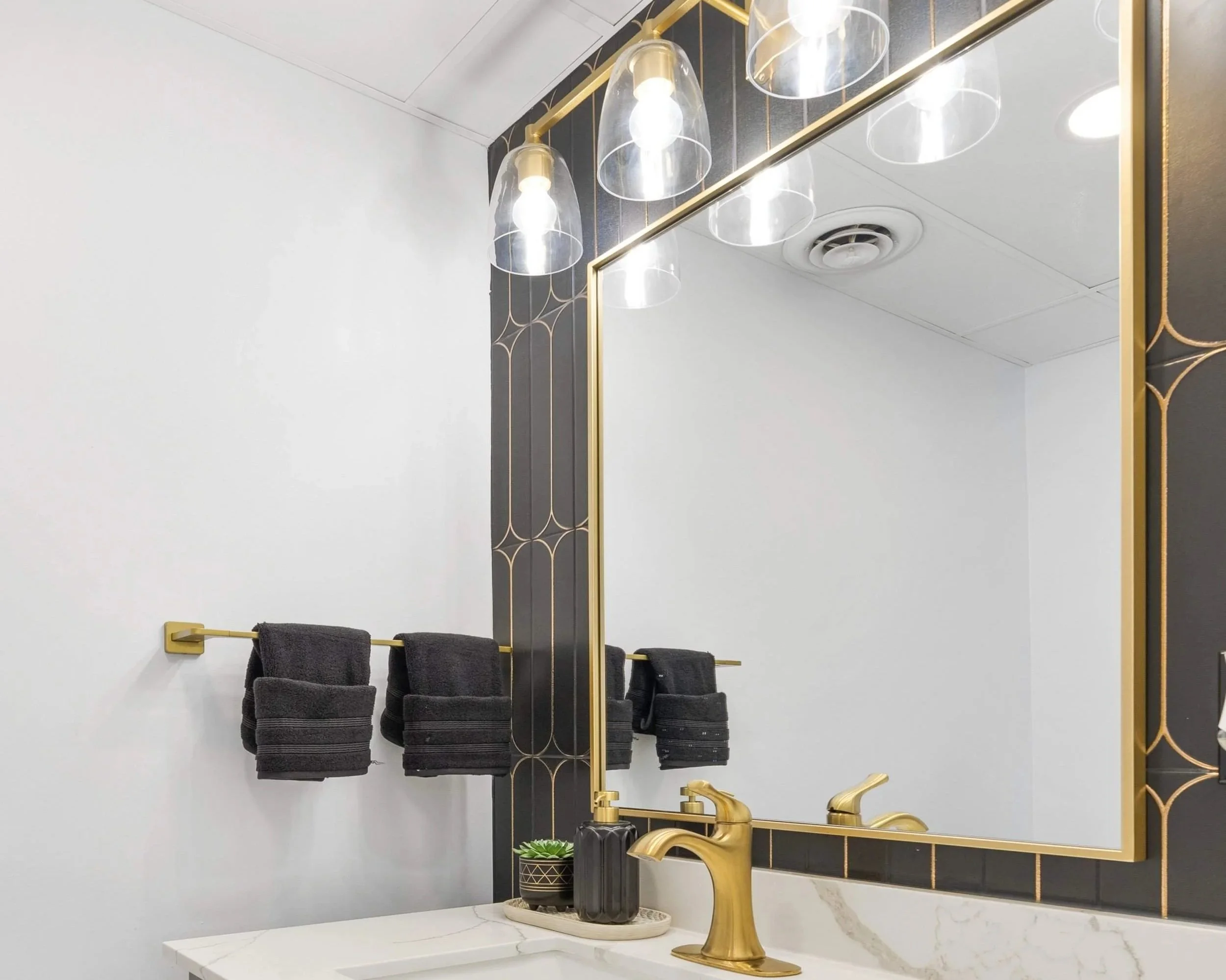 Large mirror making a small bathroom feel bigger