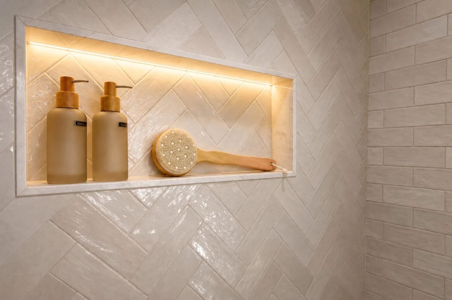 Master bathroom lighted shower niche