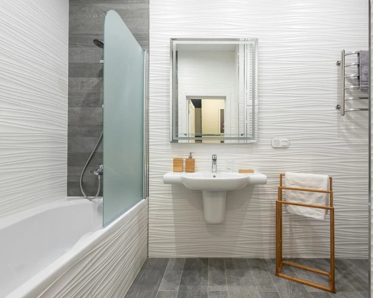 Light neutral tile in a small bathroom to create a bright and open feel