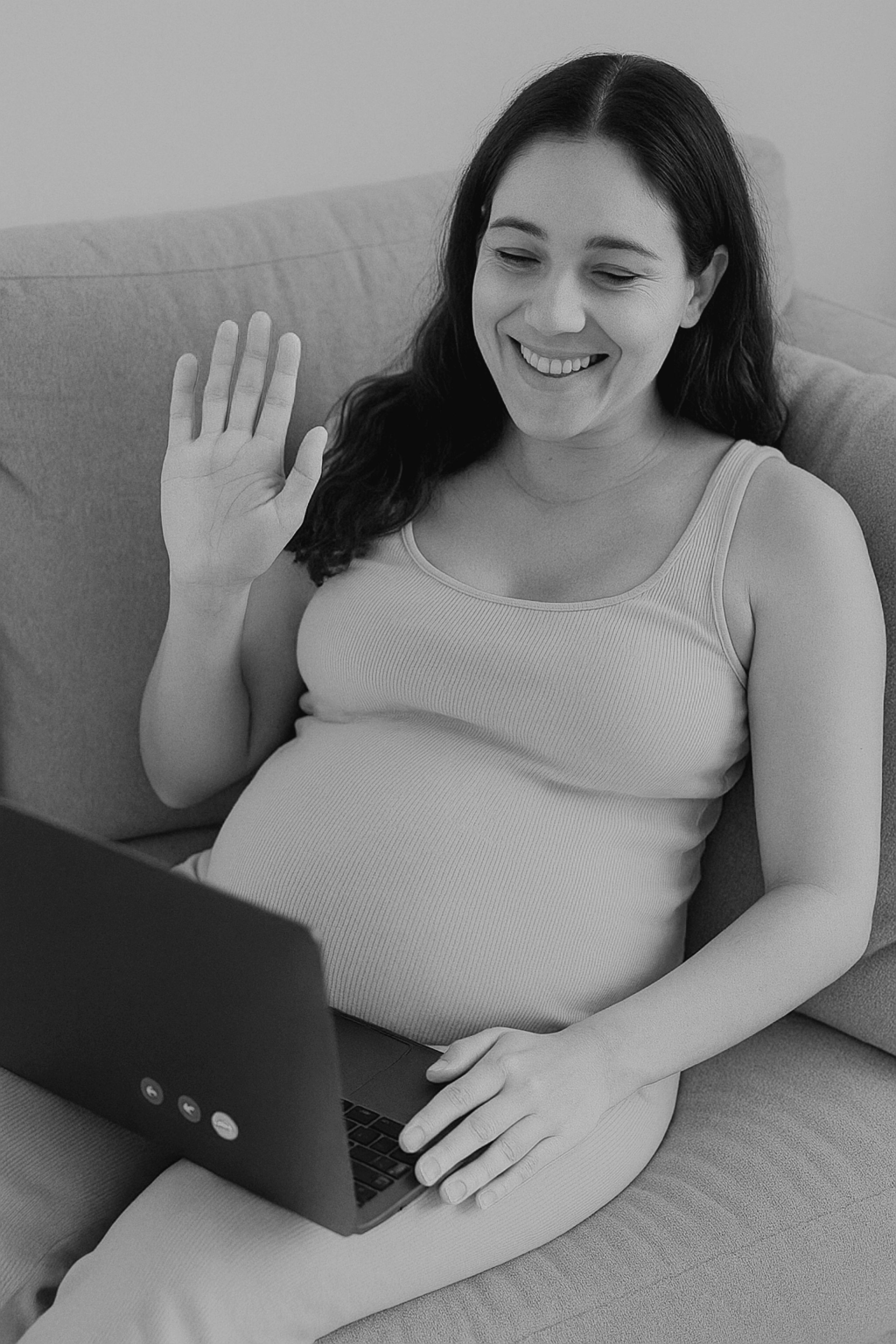 Pregnant woman on the lounge having a virtual birth support session servicing worldwide