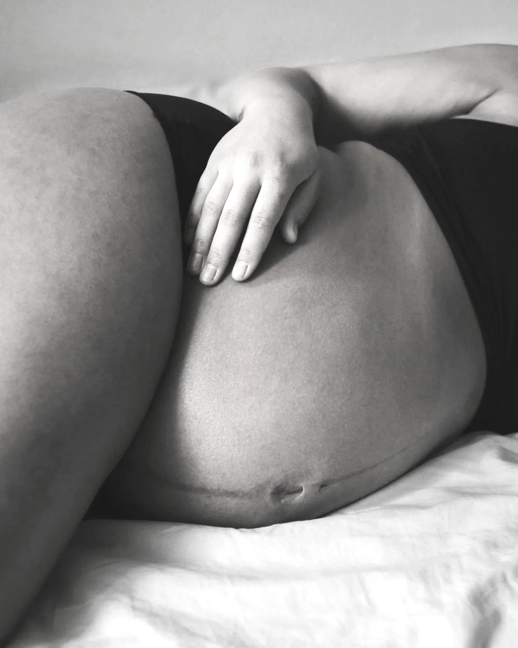 Pregnant woman laying on her side