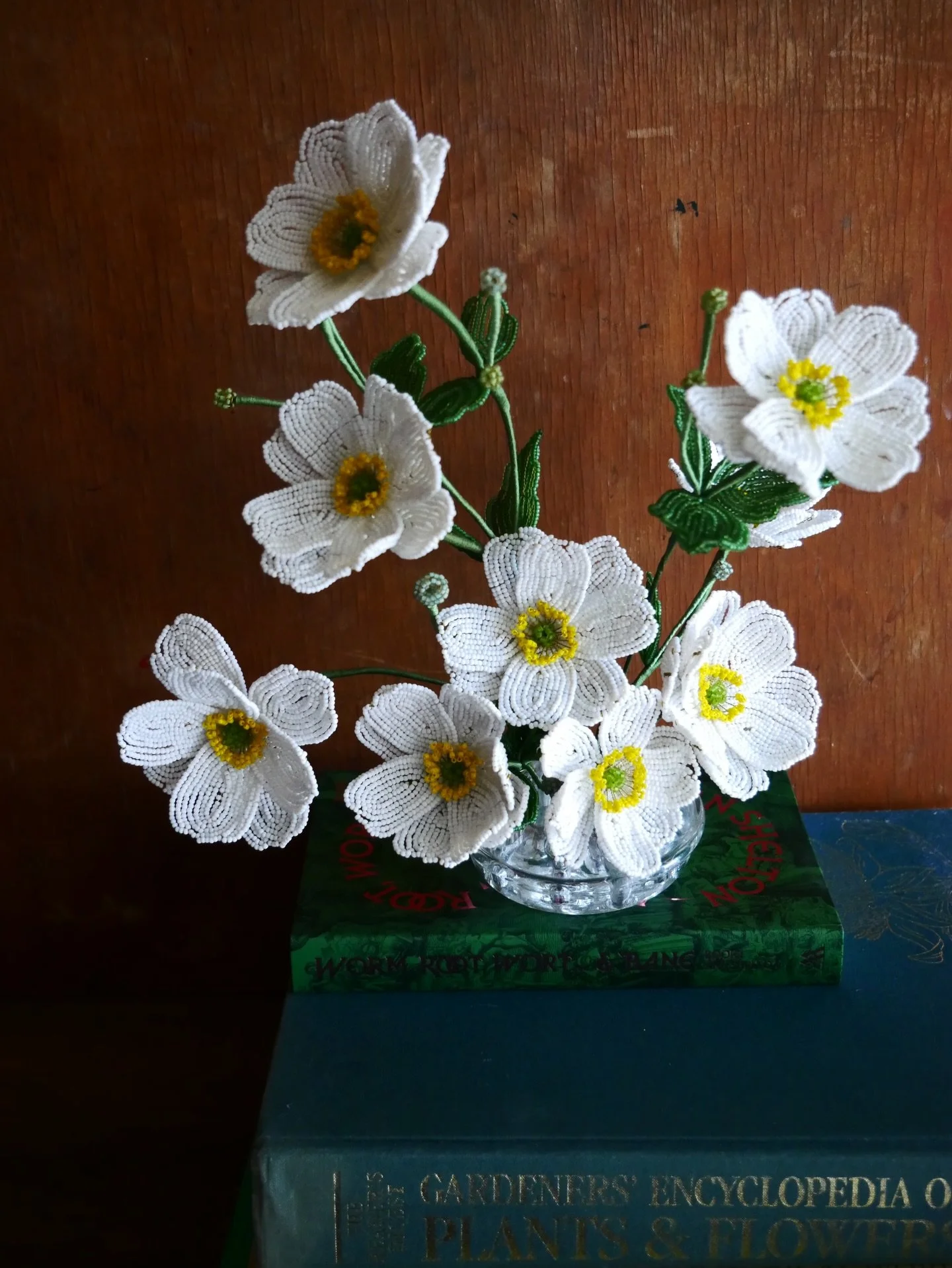 Japanese anemones in a vintage glass flower frog.
A complete arrangement, ready to place into your own shallow vessel&hellip;just don&rsquo;t add water.

Glass, copper, steel, paper and cotton.
Hand beaded in Tāmaki Makaurau, Auckland. 
$720.

Availa