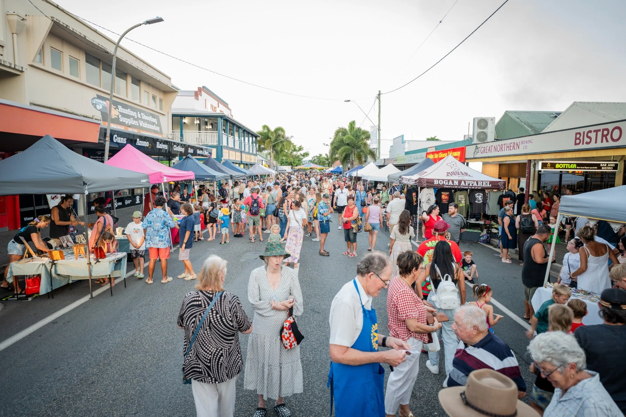 Families enjoying the Proserpine Twilight Christmas Fair on Main Street last year