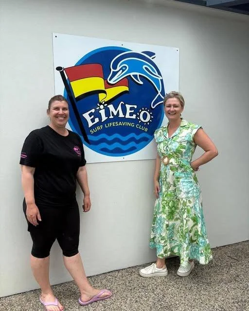 Amanda Camm with an Eimeo Surf Life Saving Club representative