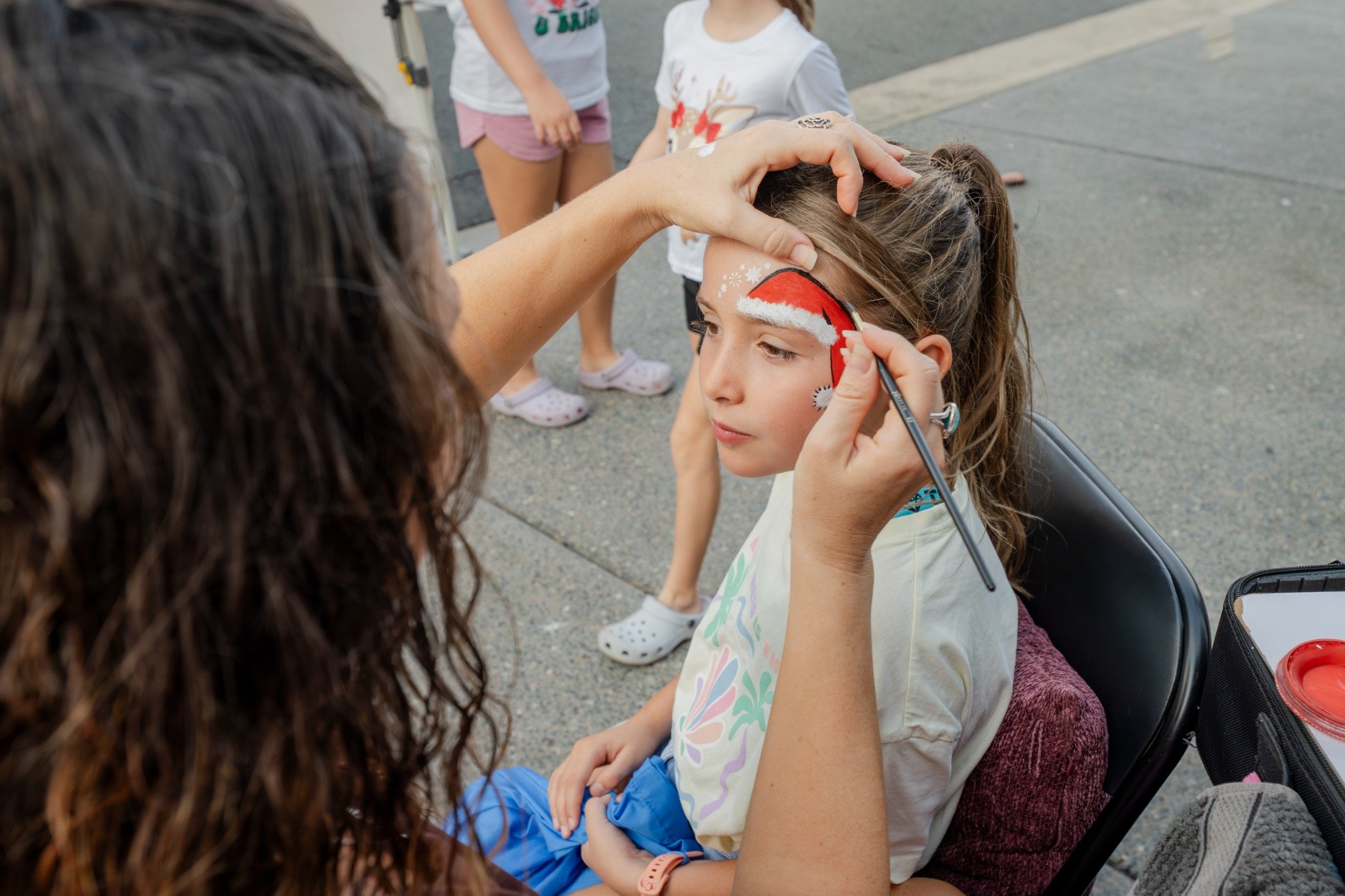 A face-painting moment from last year’s fair.