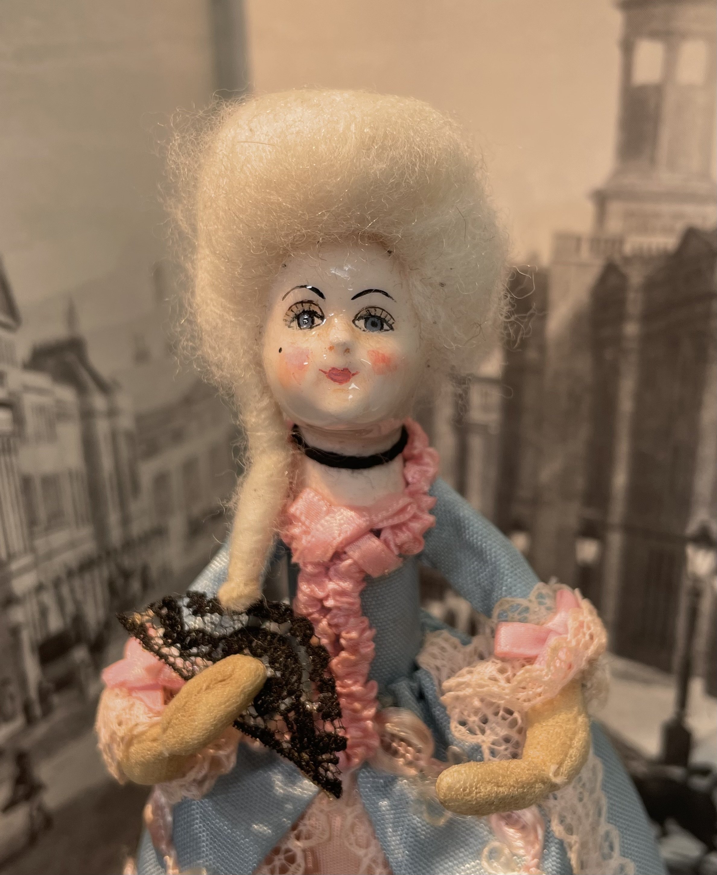Vintage peg doll with hand painted face.