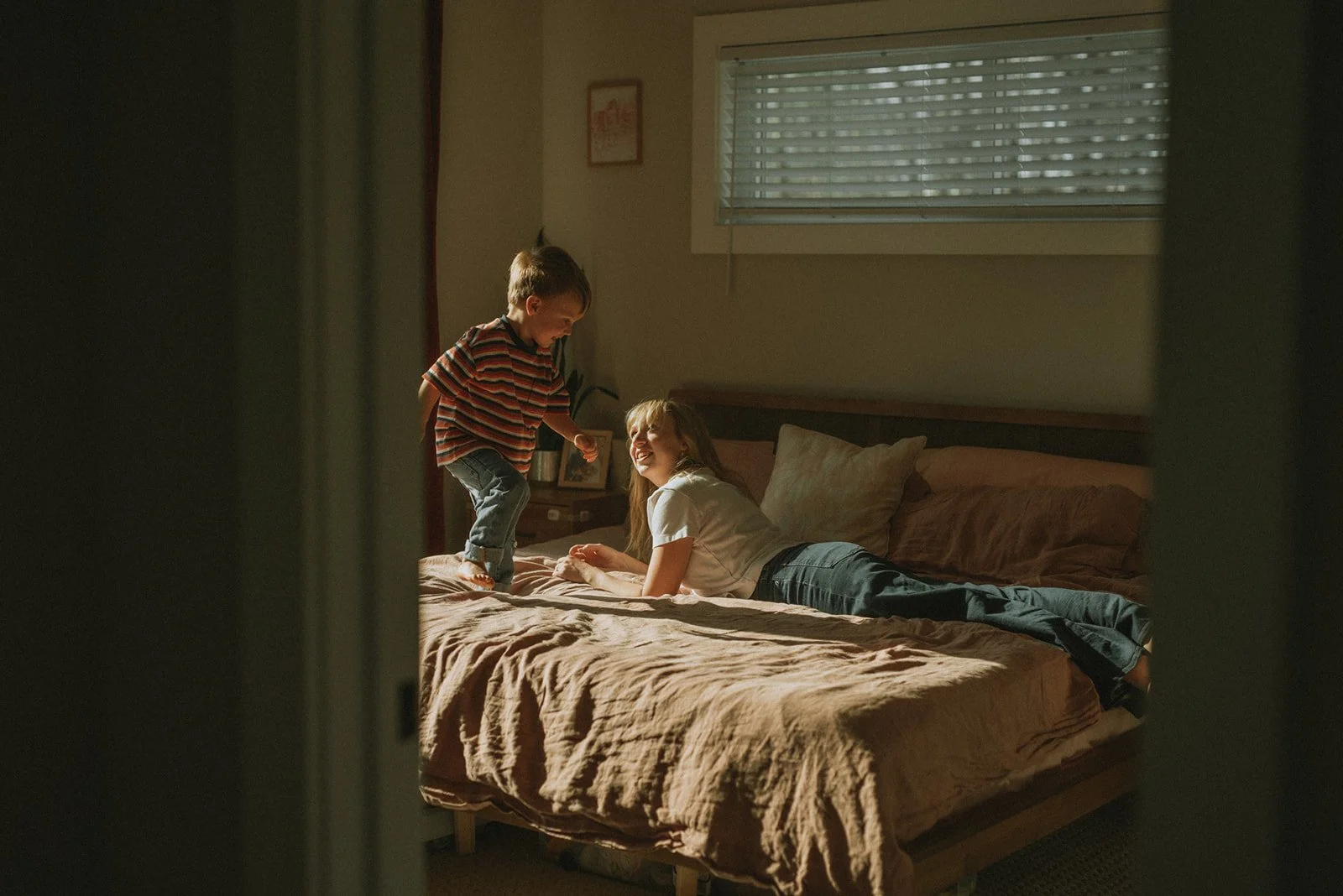 A mother smiles up at her child during a documentary family photo shoot outside of Asheville North Carolina.