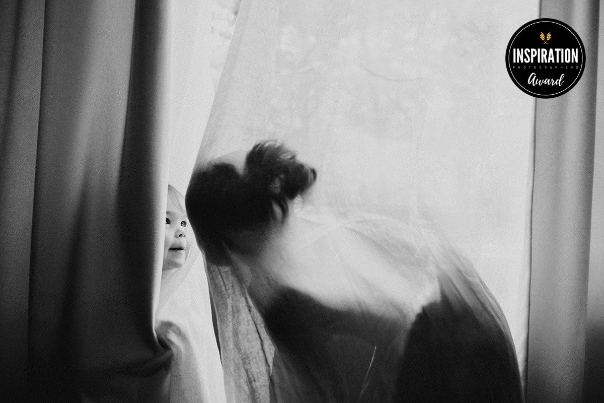 A playful and authentic moment captured by Asheville Family Photographer Melina Coogan.