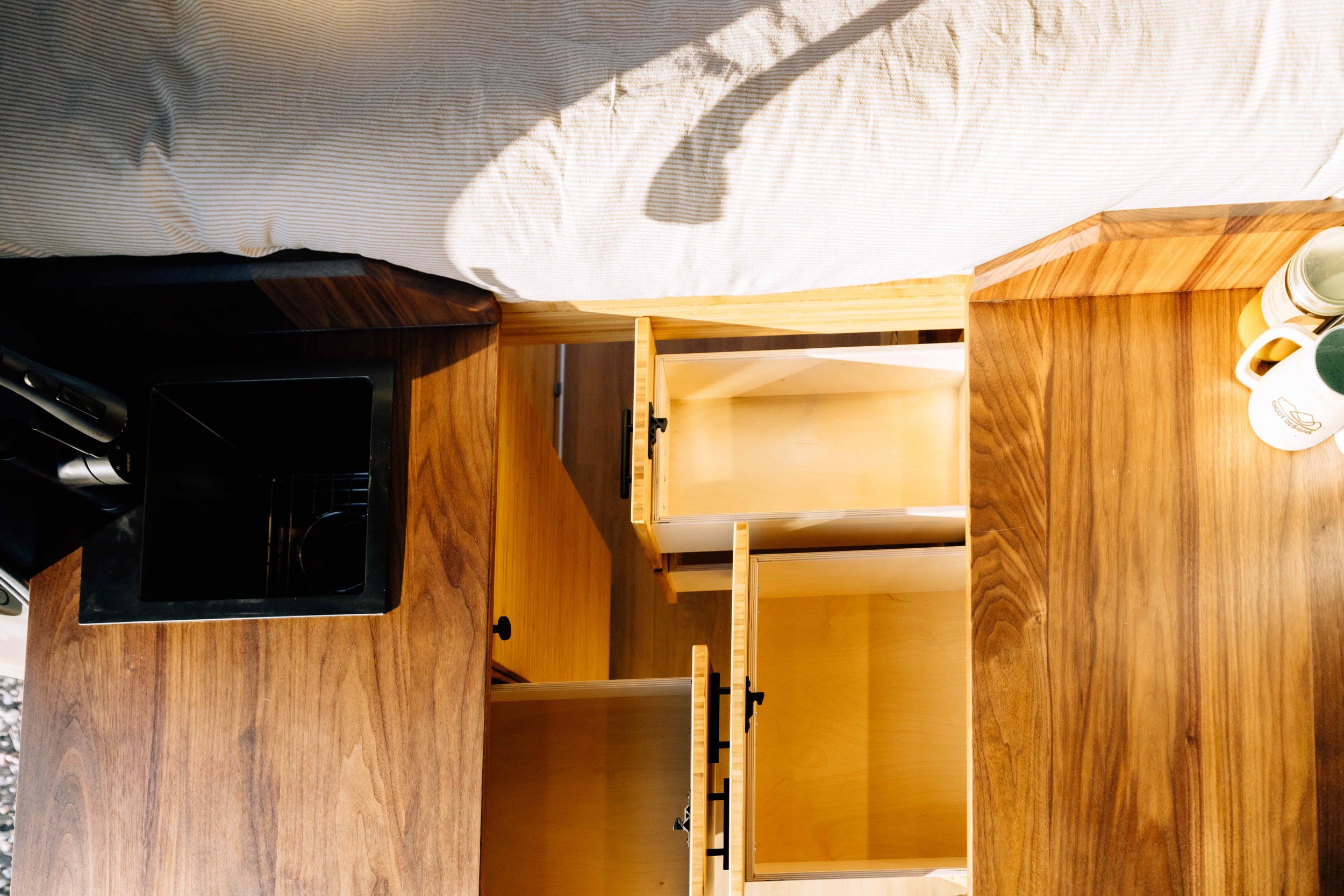Three soft close drawers Stow-away induction cooktop