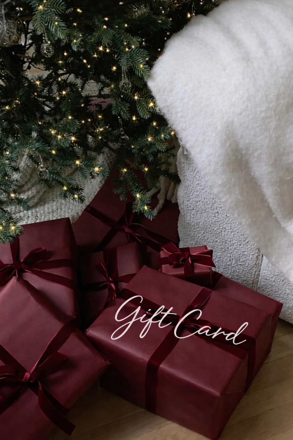 Christmas gifts under a twinkling tree.png