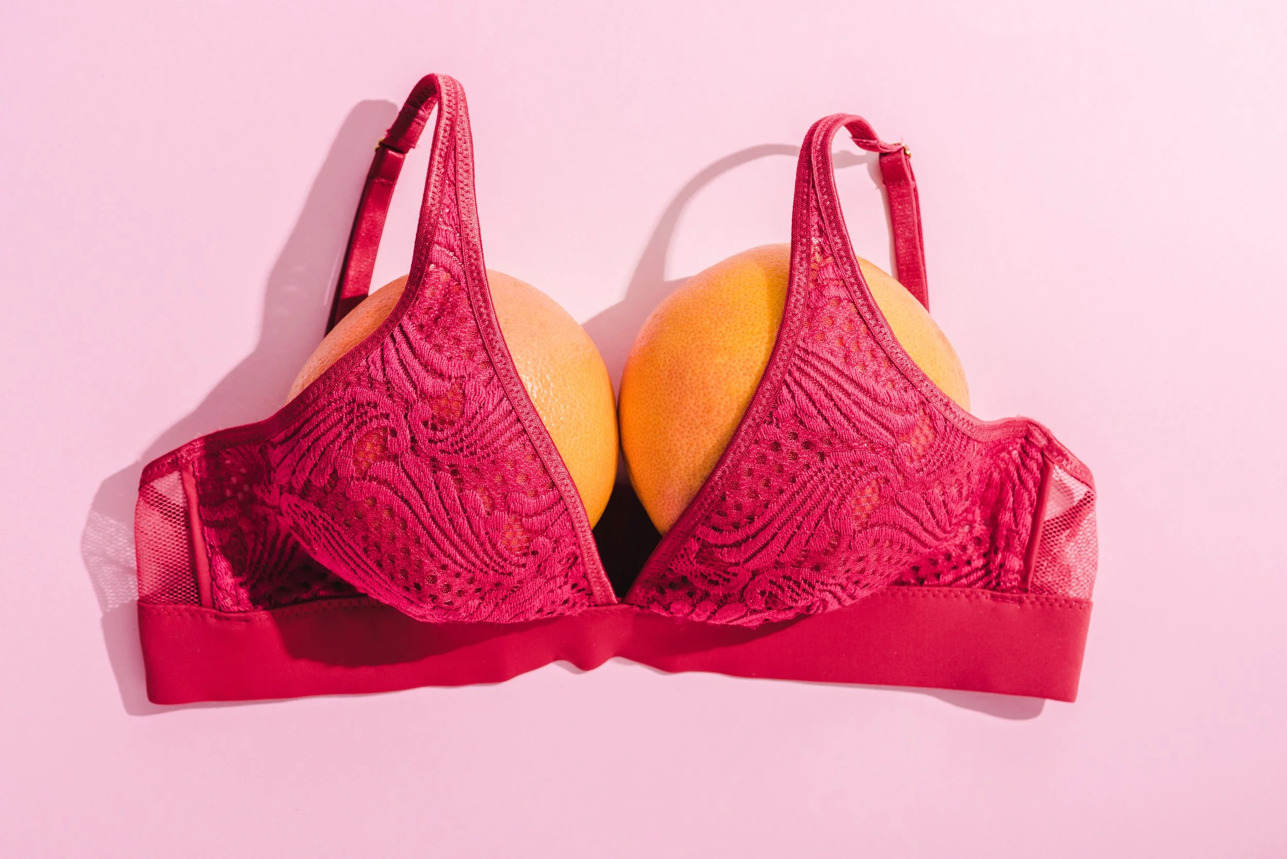 VistaCreate-257368288-stock-photo-top-view-bra-two-oranges.jpeg
