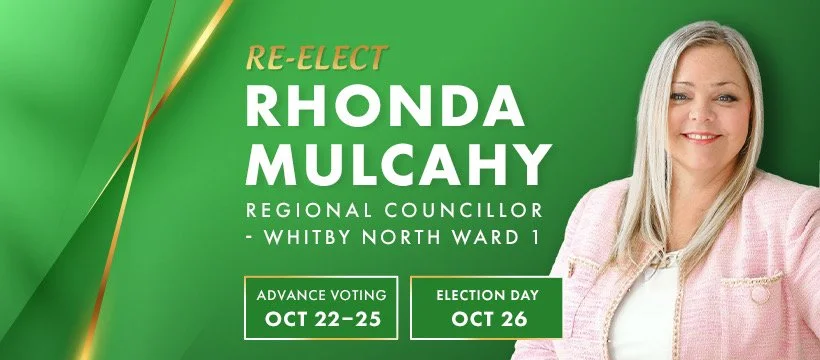 Campaign sign for Rhonda Mulcahy re-election as regional councillor for Whitby North Ward 1, featuring her smiling portrait on the right, with election dates and voting information on a green background.