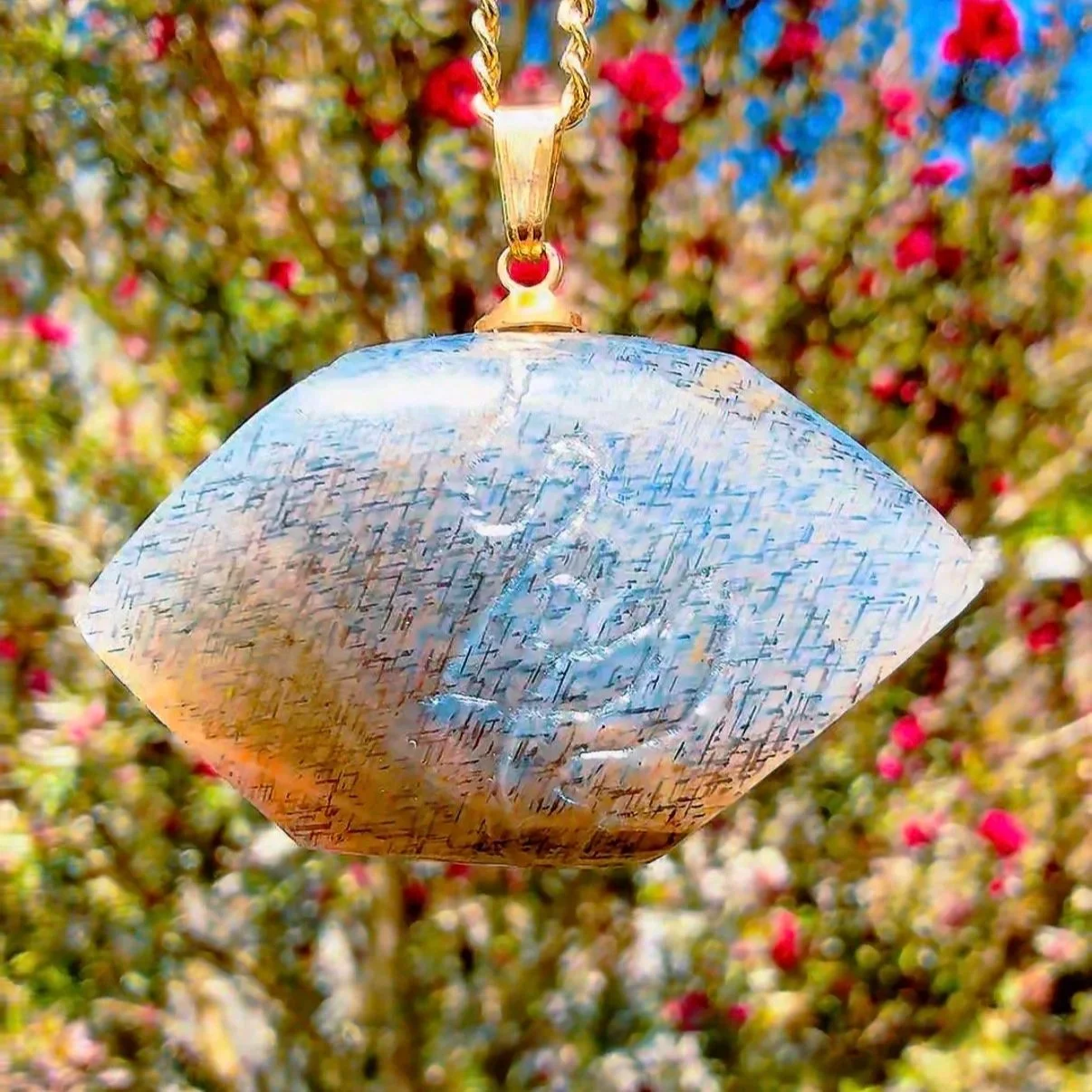 Material: Rainbow Lattice Sunstone 
Talismanic Pendant  
Sold  
I made this pendant for myself as a talisman to the sun deity, Helios. I shaped a piece of Rainbow Lattice Sunstone into a hexagon and curved it to match the sun's journey across the hor