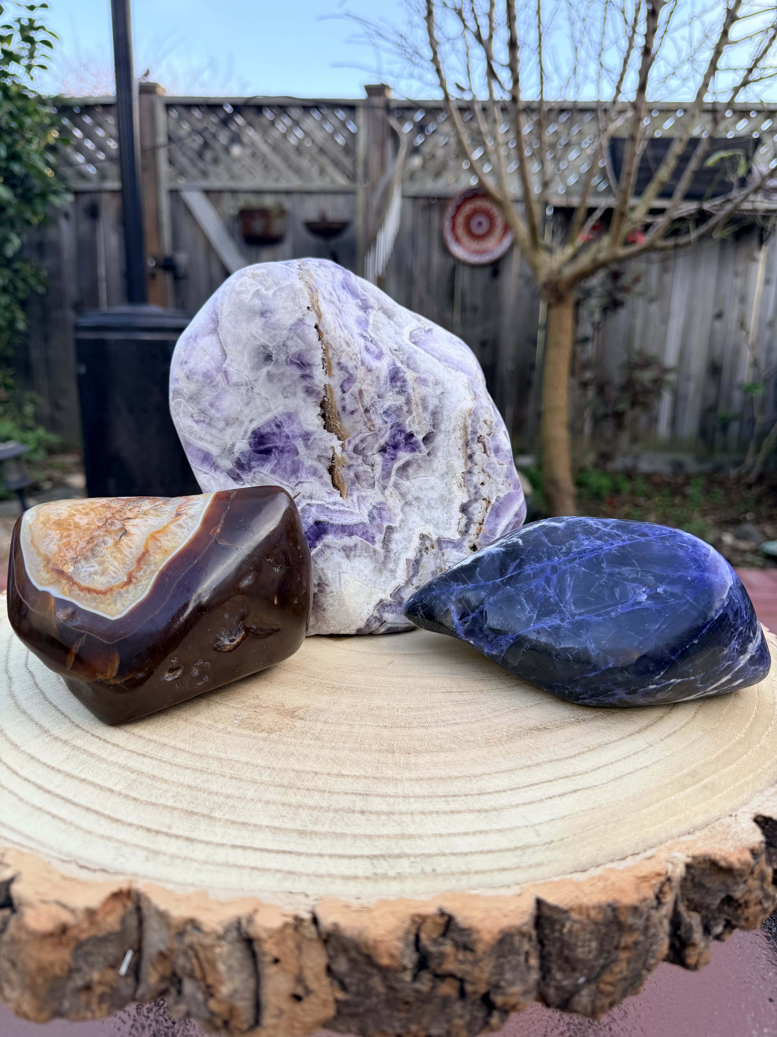 Material: Carnelian, Sodalite, Chevron Amethyst  
Title: Sauna Stones  
Sold
 
This trio of large stones was a custom order for a client who likes to work with stones in the sauna. These were all crafted to feel good in the hand and aid with deep reg