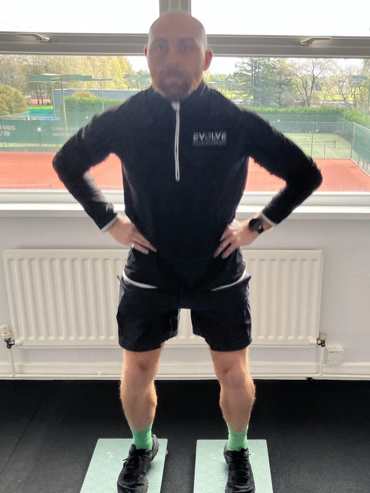 Athlete in the start position on VALD force plates before a countermovement jump (CMJ) at Evolve Physiotherapy, Swansea