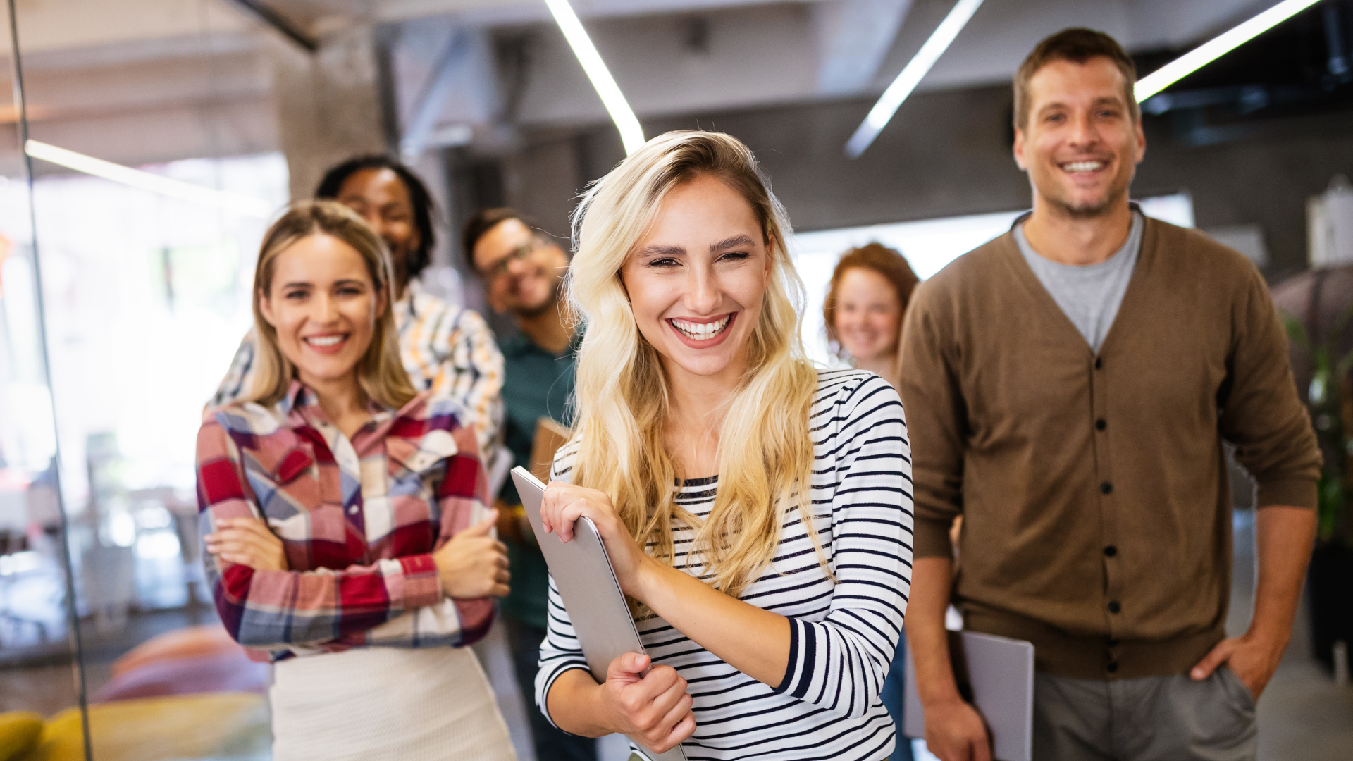 Group of employees smiling at camera