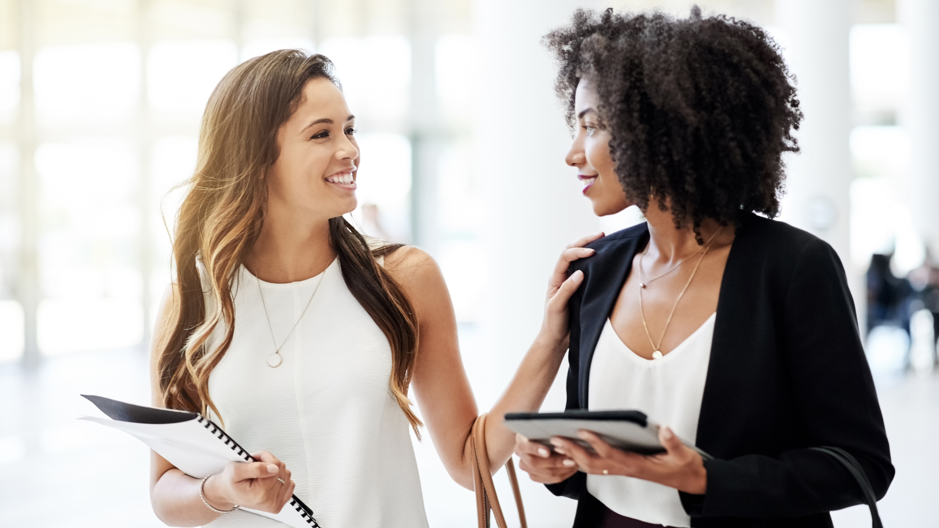 Two diverse colleagues collaborating and sharing ideas in a psychologically safe environment where they can share perspectives and disagree without fear
