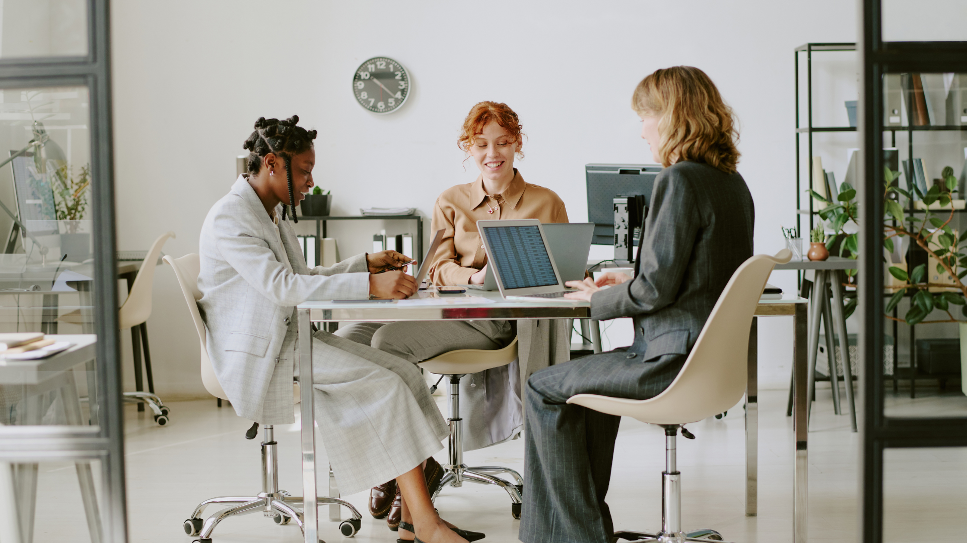 Professional women in a team meeting maximizing their time and efficiency together