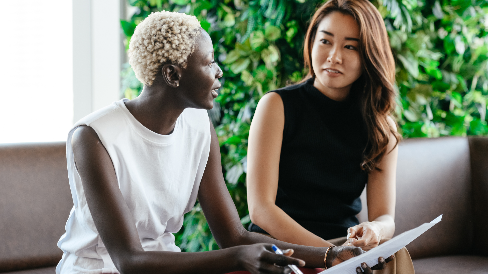 Employees chatting together in a healthy workplace environment