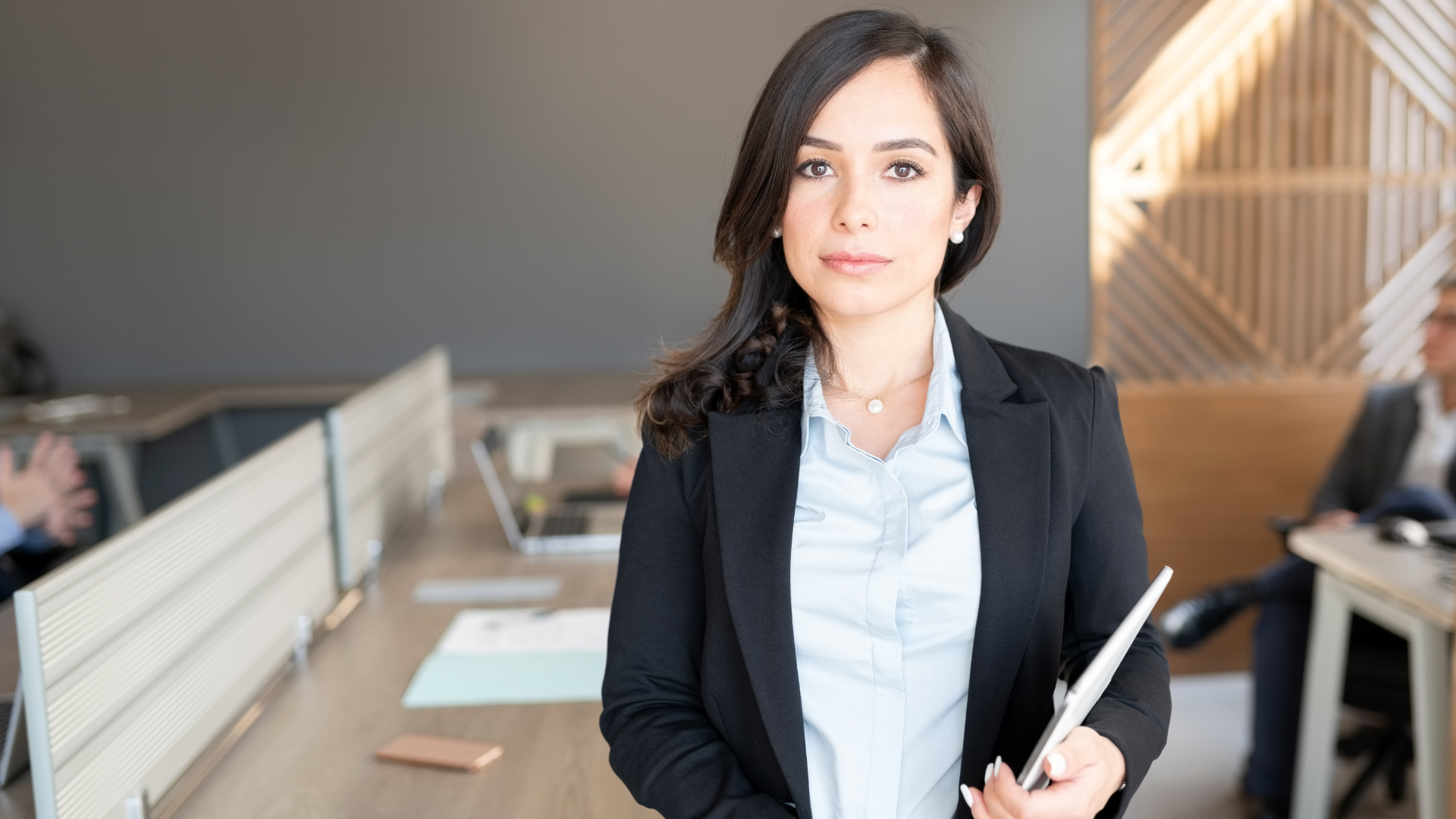 Lawyer confidently standing in an office environment after going through leadership development